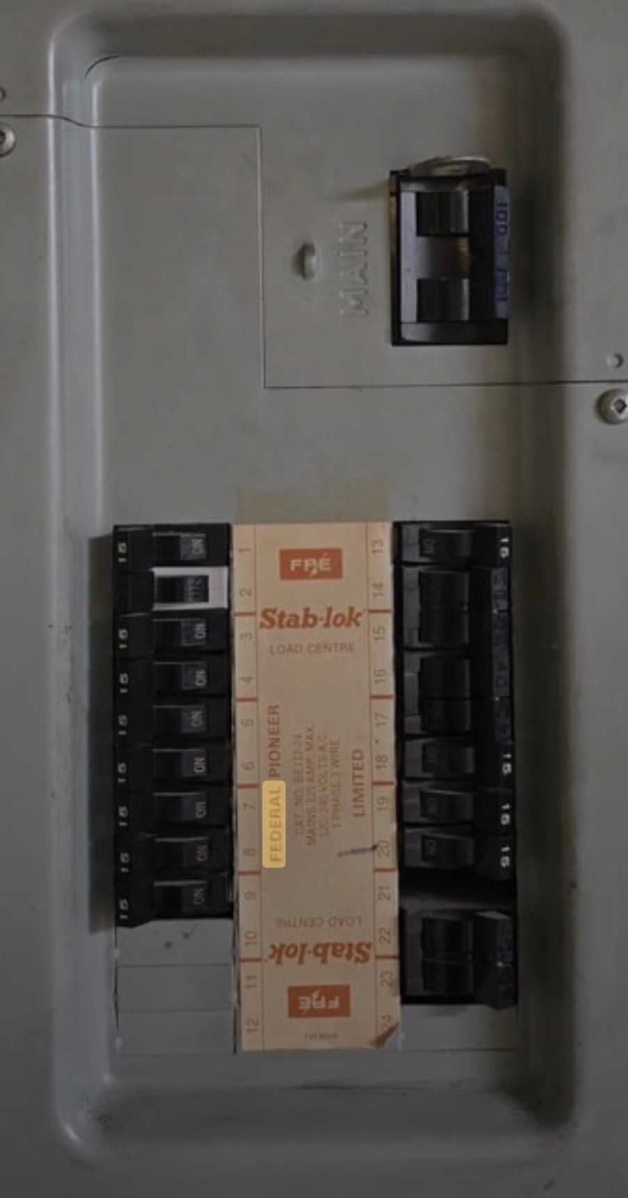 An open Federal Pacific Stab-lok electrical panel with its breakers visible